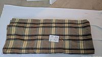 Overall folded view of the wool blanket showing plaid pattern and handwritten size label (length 86, width 70 inches approx).
