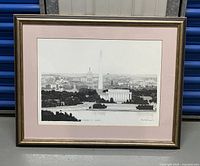 Framed black and white print of Washington D.C. cityscape, matted and signed by artist.