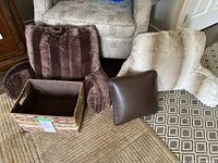 Four-piece set displayed on floor, including two large backrest pillows, one small leather-like pillow, and one woven basket.