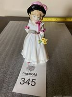 Full body view of the Royal Doulton Sharon figurine showing entire figure and packaging number tag.