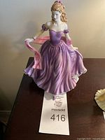 Front view of Royal Doulton 'Jessica' figurine showing full figure with purple and pink gown and scarf.
