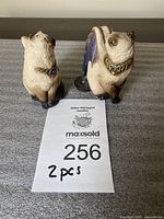 Two Windstone Editions Siamese flap cat figurines displayed side by side, showing front and side profiles.