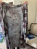 Grey floral print rib-knit open-front cardigan held open to show full length