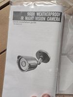 Image of a quick installation guide for Amcrest 960H Weatherproof IR Night Vision Camera, showing the camera design and label