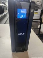 Front view showing the LCD status display with voltage and battery level indicators.