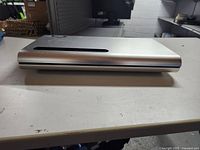 Front view of the silver Bose main unit showcasing design and condition.