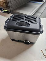 Closed fryer with lid showing ventilation and viewing window