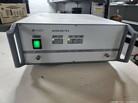 Front view of Dressler Alpha 250/75 A amplifier showing power switch, status LEDs, input/output connectors, and model branding on the front panel.