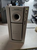 Front view of Eastern Multimedia Amplified Super Woofer showing 'SUPER WOOFER' label and bass reflex port.