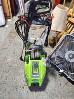 Front angled view showing body, wheels and hose arrangement.