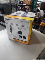Creative I-Trigue 3300 speaker system box showing product name, power rating, and images of speakers