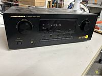 Front view of Marantz SR4200 AV Surround Receiver showing black casing, control knobs, display, and buttons.