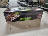 Box side showing The Fast and Furious branding, detailing the 1:24 scale Pontiac Pro Stock car and Matco Tools logo.