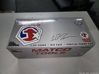 Silver box with Matco Tools branding and labels showing 1:24 scale die cast Pontiac Funny Car.