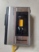 Front view of Panasonic Mini Cassette Recorder RD-150 showing cassette tape inside and model number.