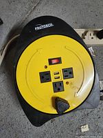 Front view of Protorch power strip featuring 3 power outlets, 2 USB ports, and power switch with LED indicator.