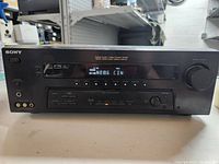 Front view of Sony Digital A/V Control Center receiver showing the control panel, buttons, display screen, and input/output ports.