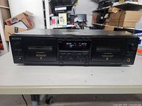 Front view of the Sony stereo cassette deck with both cassette compartments visible and controls in the center.