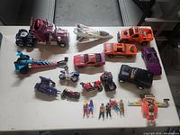 Overhead view of all M.A.S.K. vehicles, figures and manuals