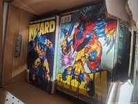Box filled with Wizard magazines from the 1990s featuring Marvel superhero covers including Wolverine and Spider-Man.