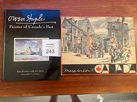 Two books side by side: 'Owen Staples: Painter of Canada's Past' and 'Macpherson's Canada' with artwork on covers.