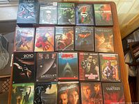 A photo showing 22 DVD sci-fi and fantasy movies arranged on a surface.