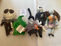 Five Nightmare Before Christmas plush characters displayed in one photo, showing size and condition