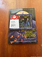 Cover of large hardcover Nightmare Before Christmas animation book by Frank Thompson with foreword by Tim Burton, featuring film and art content