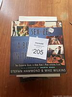 Top view of the book 'Sex and Zen & A Bullet in the Head' showing the cover design and title.