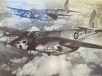Photo of black and white vintage war plane poster featuring twin-engine military aircraft with roundel markings flying in formation above clouds.