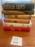 Stack of 6 vintage books showing titles and general condition