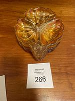 Stacked view of the five iridescent glass candy dishes showing shape and translucency.