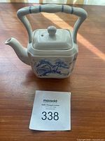 Square vintage James Sadler ceramic teapot with blue scenic design and bamboo-style handle.