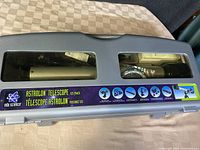 Closed carrying case showing brand, model and viewing windows.