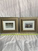 Two 14x16 inch ornate gold-toned frames each containing 6.5x4.5 inch Don Li-Leger prints of waterfowl and reeds, placed side by side with a tape measure showing frame width.