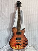 Front full view of guitar showing body, neck, and headstock against white drape