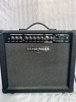 Front view of Behringer VT30FX amp showing control panel and Behringer logo.