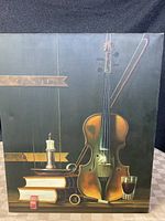 Full view of the oil on canvas painting showing the violin, books, glass, and candle holder against a dark backdrop.