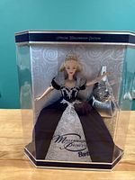 Front view of the Barbie Millennium Keepsake doll in original clear display box showing doll in blue and silver gown with tiara and ornament display.