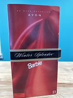 Front view of the boxed Winter Splendor Barbie showing the Avon exclusive special edition label.