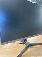 Front side of the 27-inch Samsung monitor on stand showing clean screen and slim bezel design.