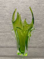 Full view of green/clear sculptural Chalet glass vase