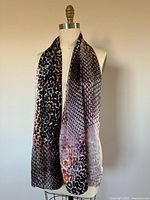 Full view of scarf draped on mannequin