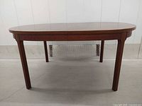 Full view of oval rosewood dining table