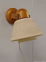 Front angled view showing pine backplate, arm and shade