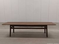Full side view of walnut surfboard coffee table