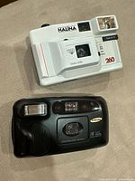 Front view of both cameras showing lenses and branding