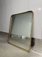 Front view of full mirror leaning against wall