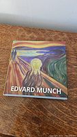 Front cover of the hardcover art book featuring Edvard Munch's famous painting 'The Scream'