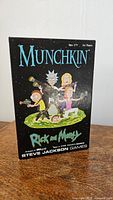 Box front showing Munchkin Rick and Morty Edition with cartoon characters from the series